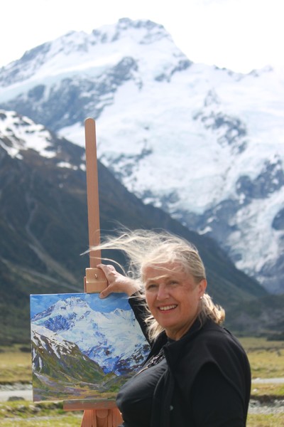 Belinda Weir with her Mount Sefton painting